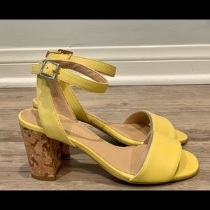 Canary colored Anthropologie leather with cork heal strapped sandals